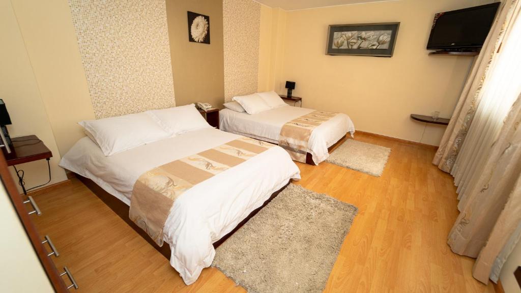 Postel nebo postele na pokoji v ubytování Hotel Ficoa