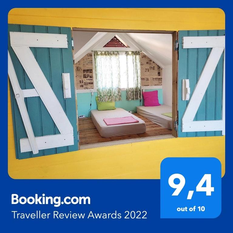 Postel nebo postele na pokoji v ubytování Ô PasSage - Kaz Auberge