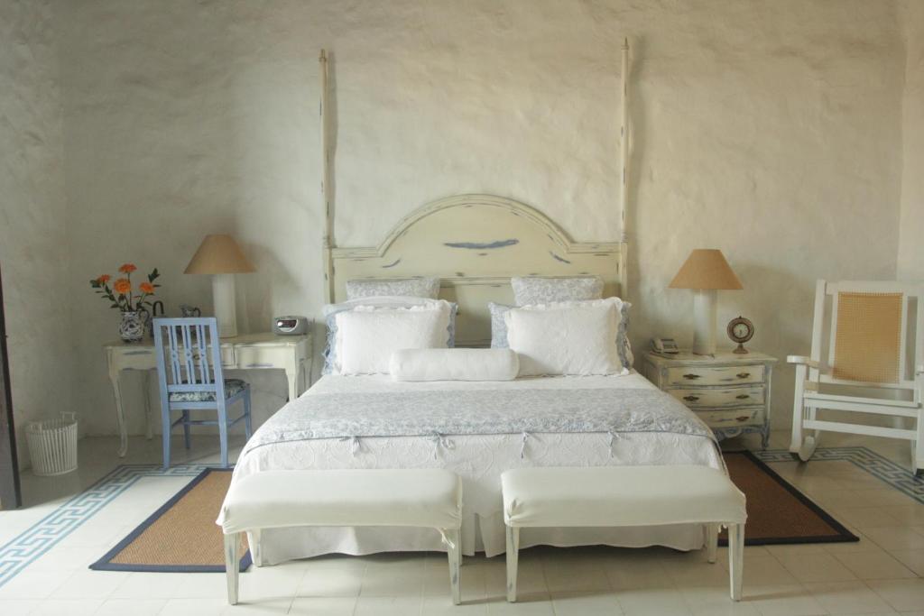 Postel nebo postele na pokoji v ubytování Hotel Casa Quero