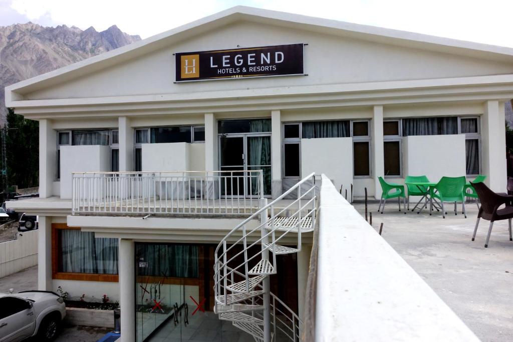a building with a sign that reads legend hotel and rooms at Legend Hotel Skardu in Skardu