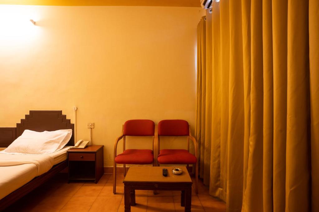Postel nebo postele na pokoji v ubytování The Sincro Hotel