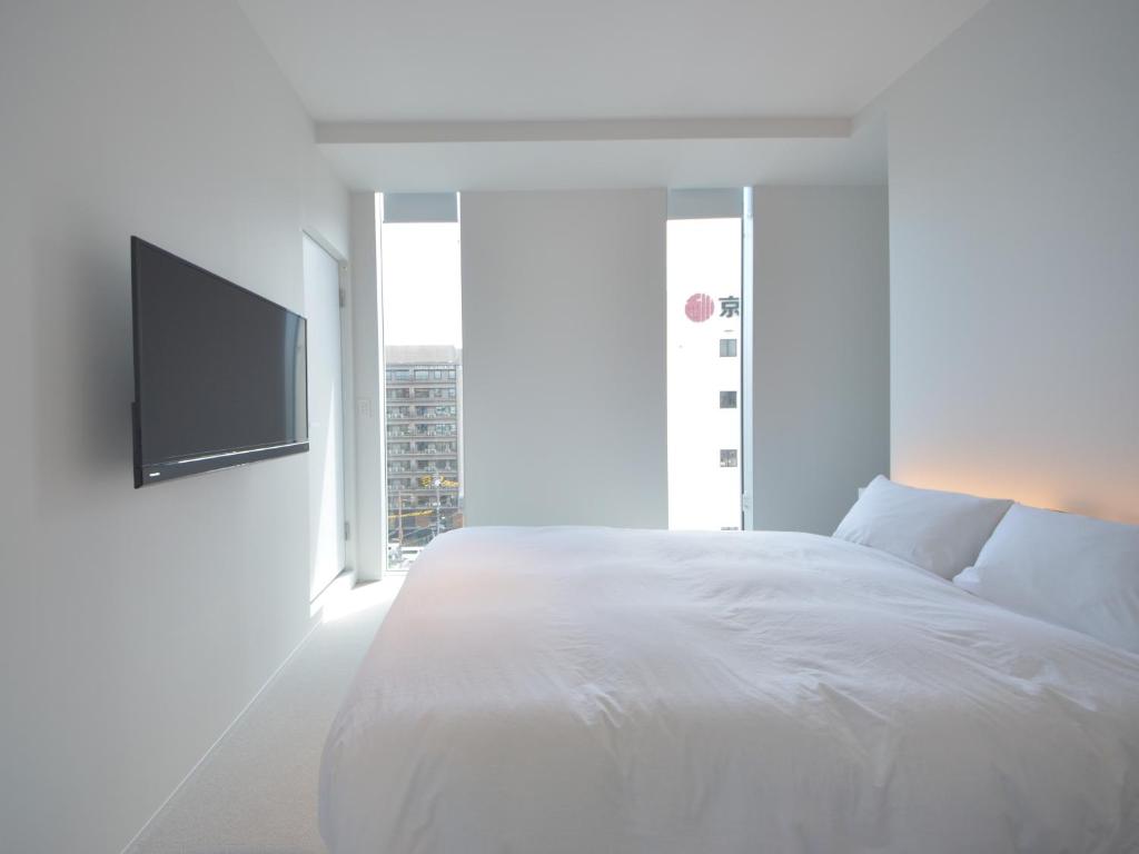 Postel nebo postele na pokoji v ubytování Carta Hotel Kyoto Gion
