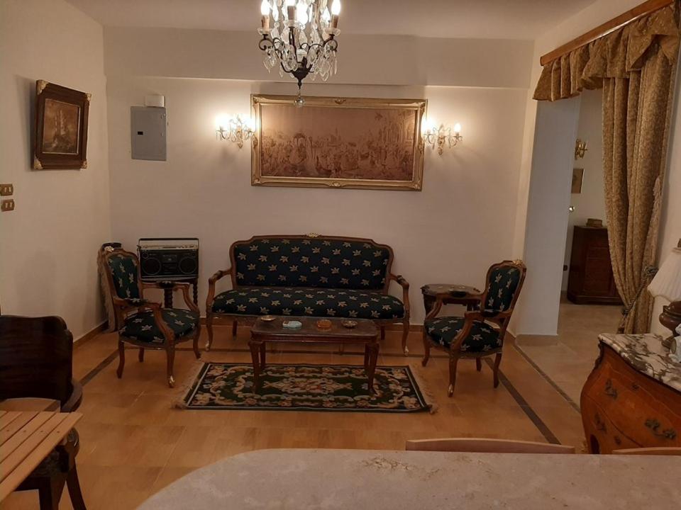 a living room with a couch and chairs at Small Friendly Apart In a Villa - New Cairo 5th Settlement in Cairo