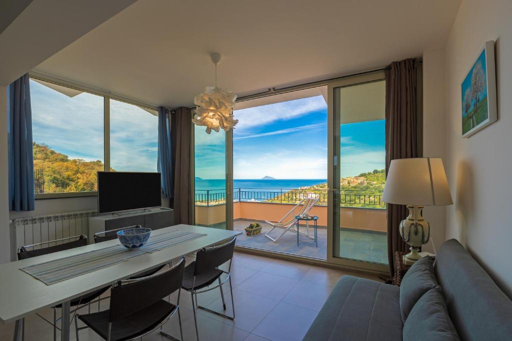 a living room with a view of the ocean at Residence Mersa in Brolo