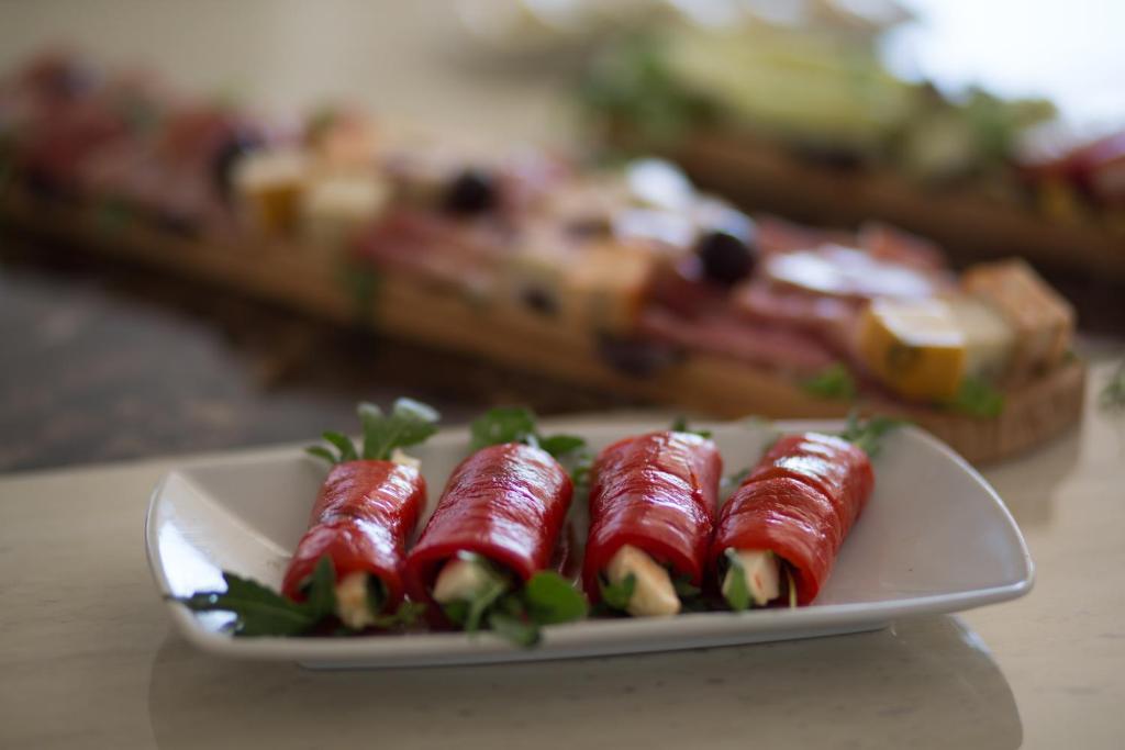 a plate of food on a table at Spa Resort Luxury Apartments in Budva