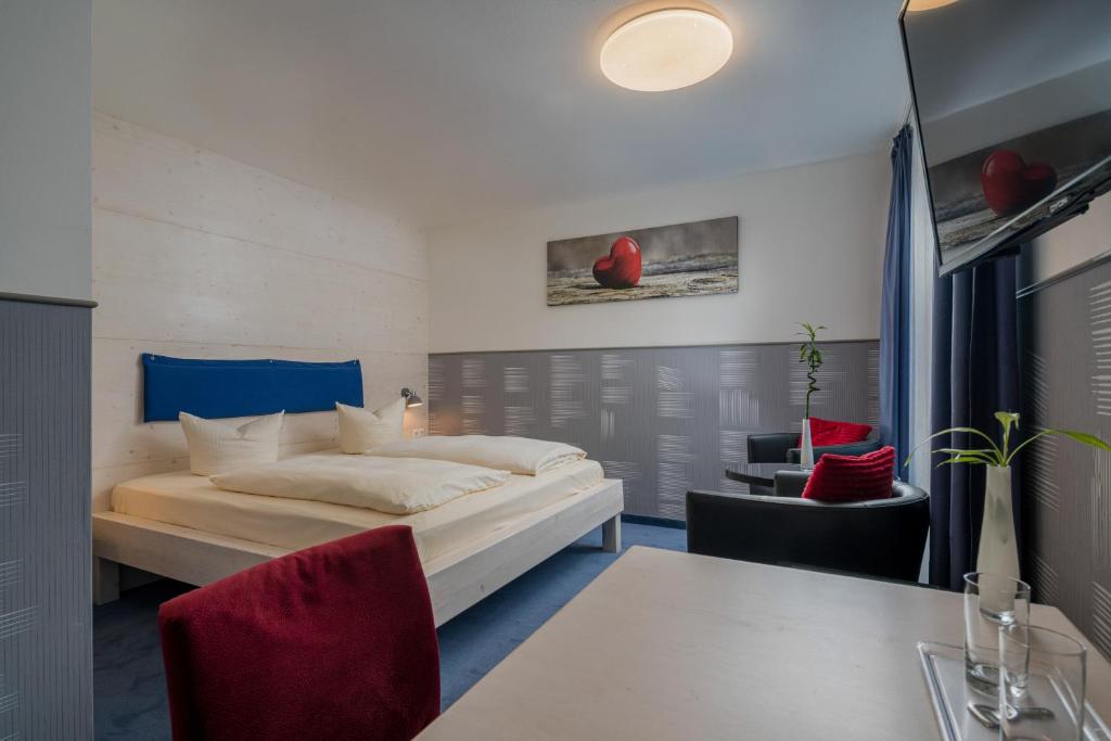 Postel nebo postele na pokoji v ubytování Hotel Fidelio