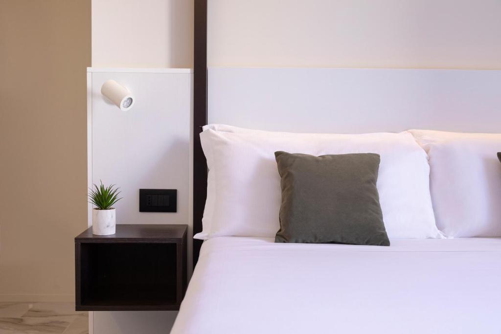 Postel nebo postele na pokoji v ubytování Pietra Bianca Hotel