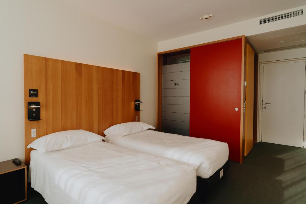 Postel nebo postele na pokoji v ubytování NEW IPOINT HOTEL