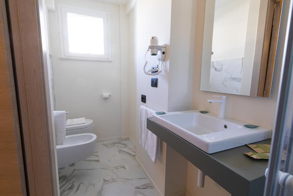 Koupelna v ubytování Pietra Bianca Hotel