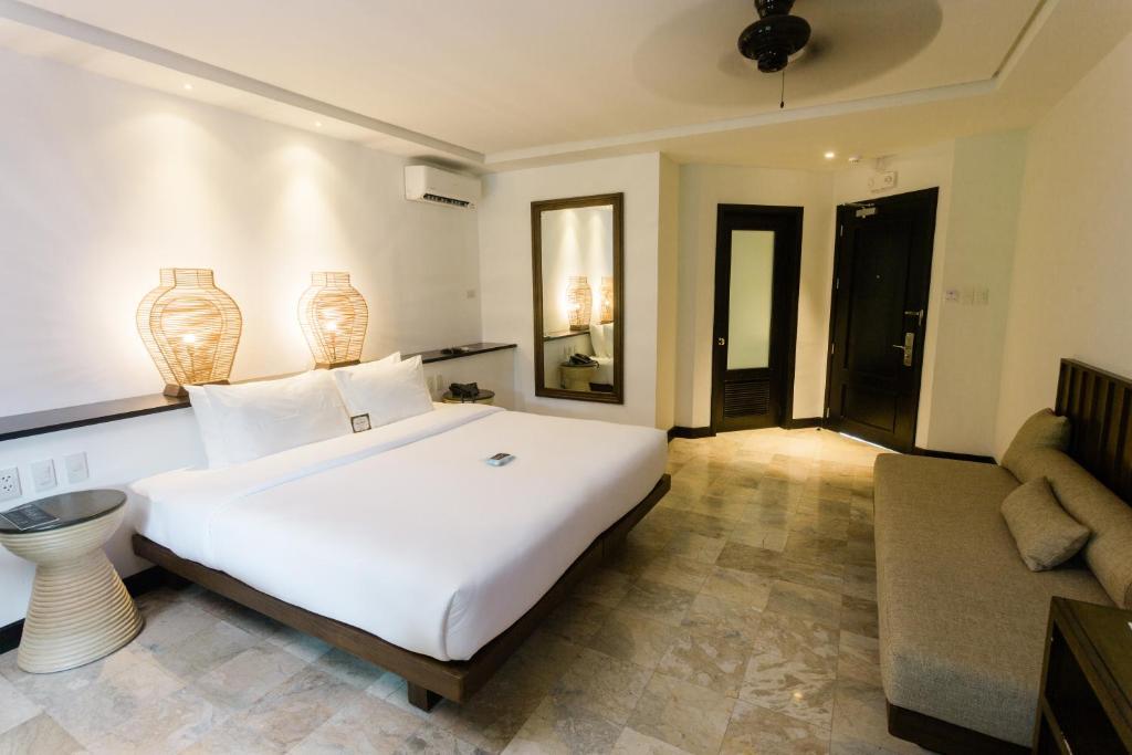 Postel nebo postele na pokoji v ubytování The Henry Resort Dumaguete