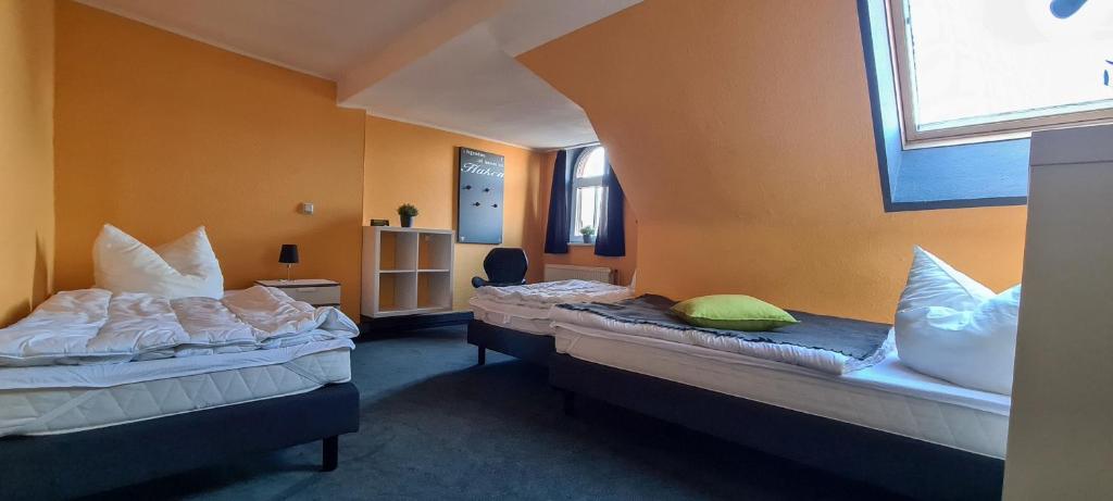 Letto o letti in una camera di Harz Hostel
