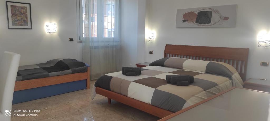 Posteľ alebo postele v izbe v ubytovaní Pasqualina's House