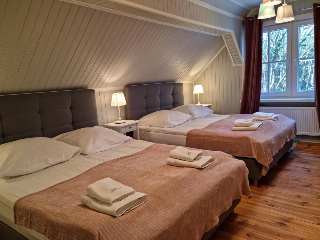 Кровать или кровати в номере Mistral przy plaży Domki całoroczne