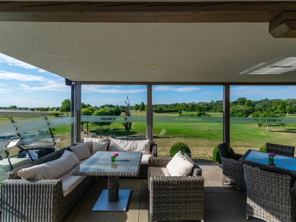 Posedenie v ubytovaní Apartment Near Golf Course