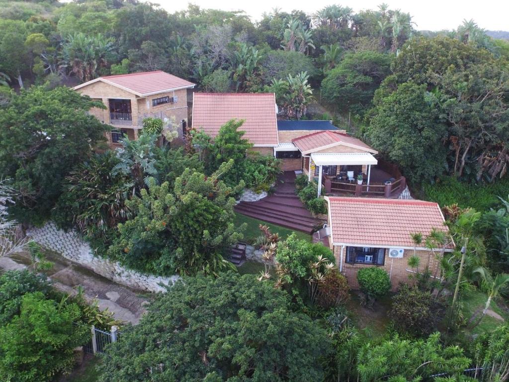 an aerial view of a house in the forest at Xanadu Guest House in Sea Park