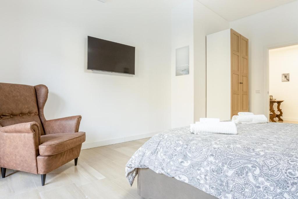 Łóżko lub łóżka w pokoju w obiekcie Vomero Deluxe Apartments