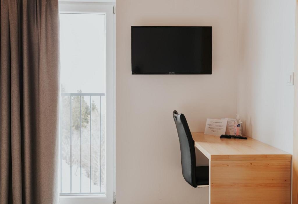 TV a/nebo společenská místnost v ubytování Hotel House Rozka