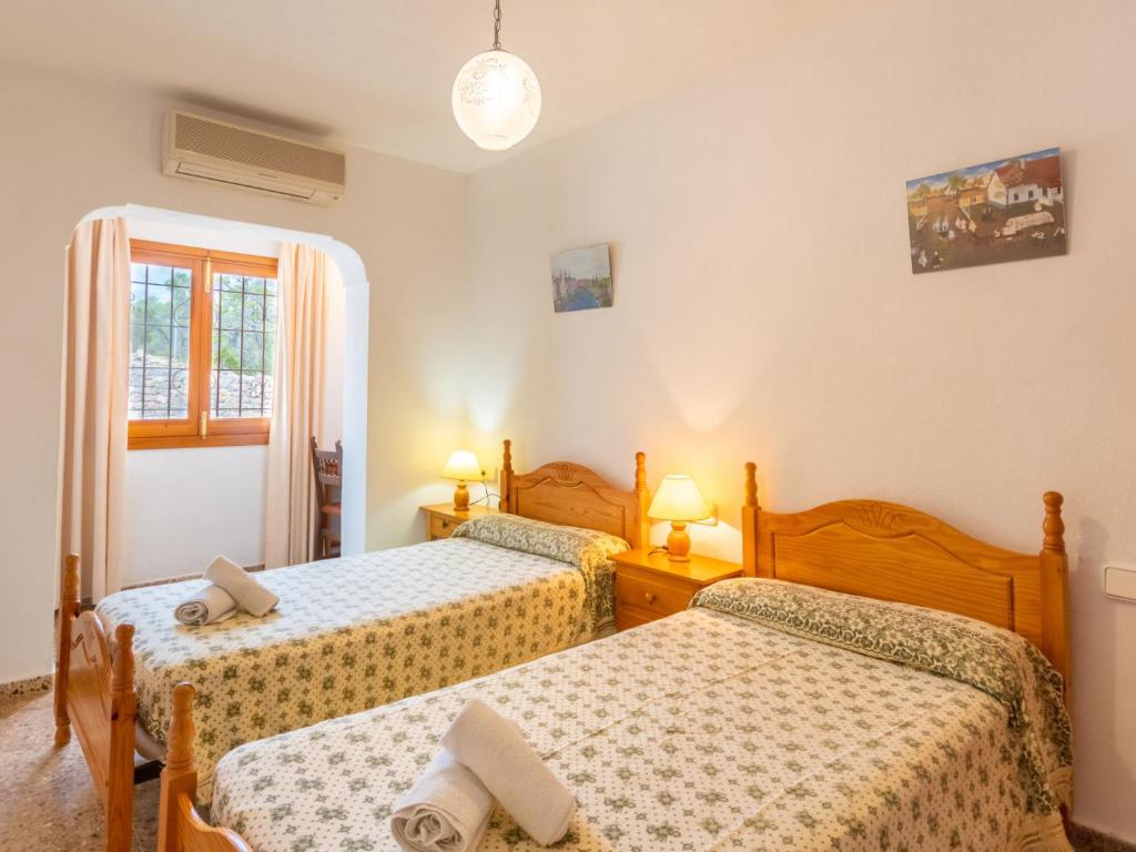 Postel nebo postele na pokoji v ubytování Holiday Home Can Pep Jaume by Interhome