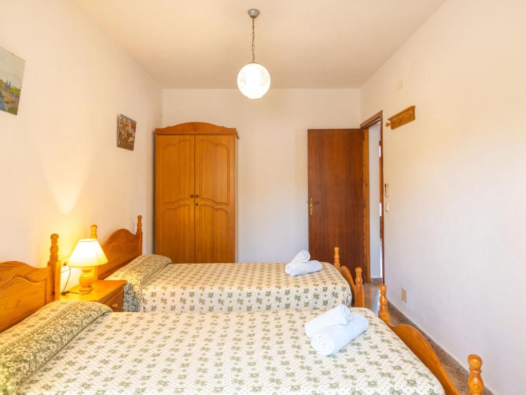 Postel nebo postele na pokoji v ubytování Holiday Home Can Pep Jaume by Interhome
