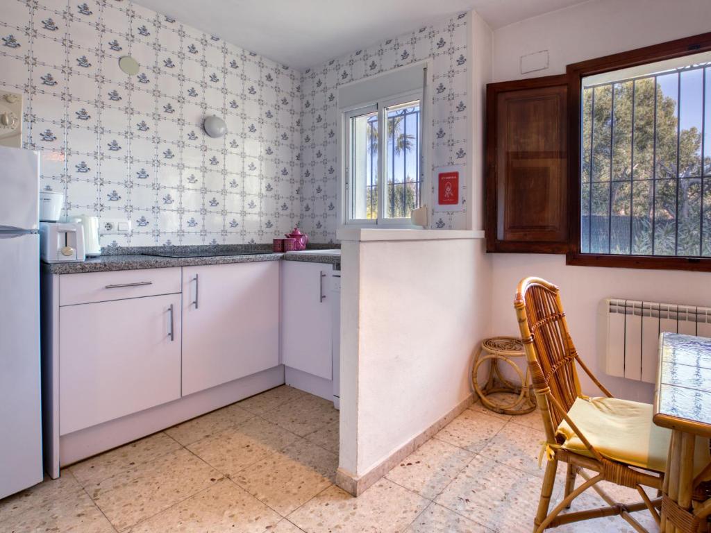 Kuchyň nebo kuchyňský kout v ubytování Holiday Home Masirope by Interhome
