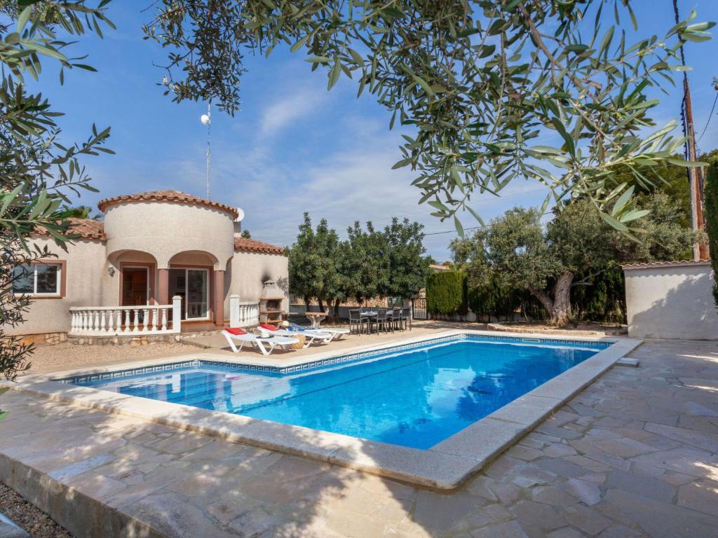 a villa with a swimming pool and a house at Villa Villa Cala Vidre B by Interhome in Les tres Cales