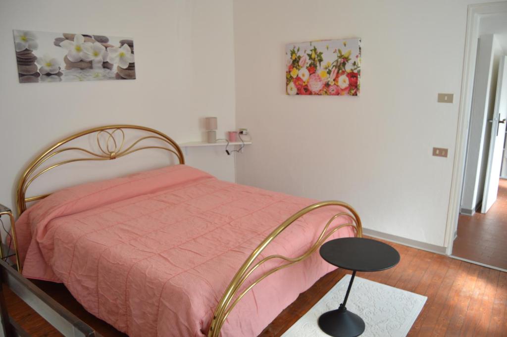 A bed or beds in a room at Casa della Rosina