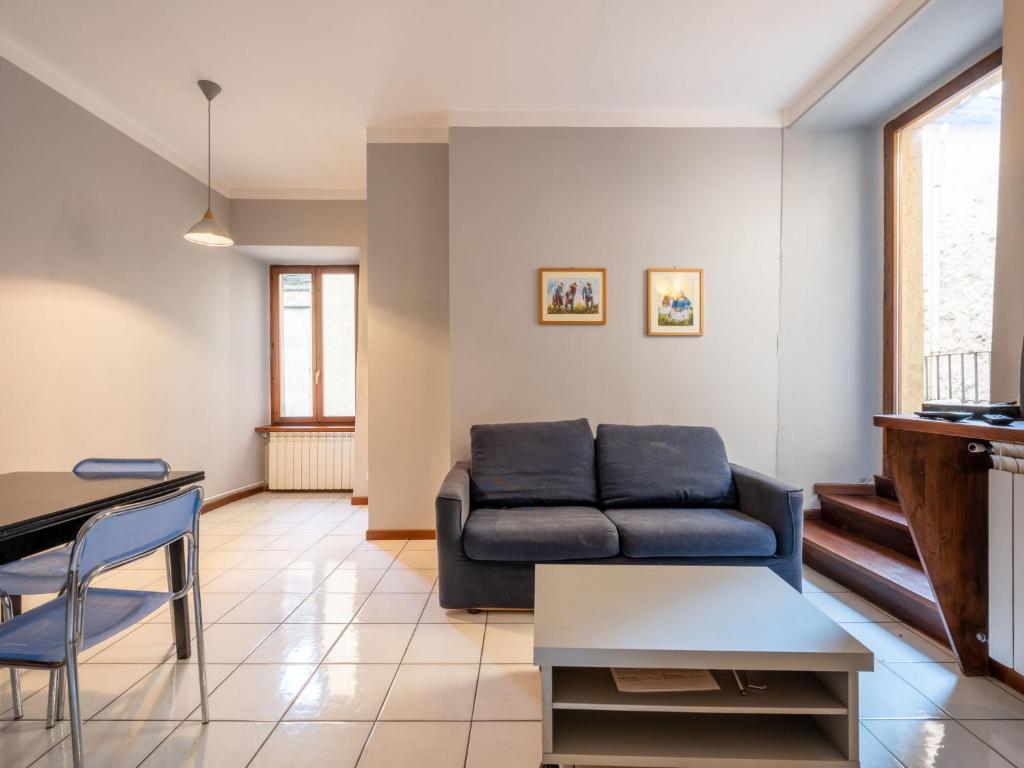 a living room with a couch and a table at Apartment Borgo Vecchio by Interhome in Orta San Giulio