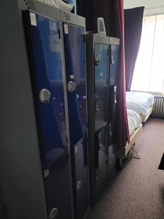 Palanda nebo palandy na pokoji v ubytování Les Fleurs Accommodation