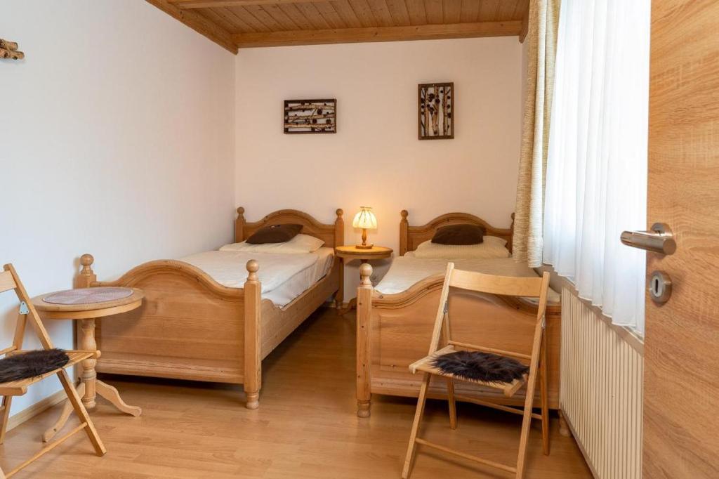 Postel nebo postele na pokoji v ubytování Landhaus Laih