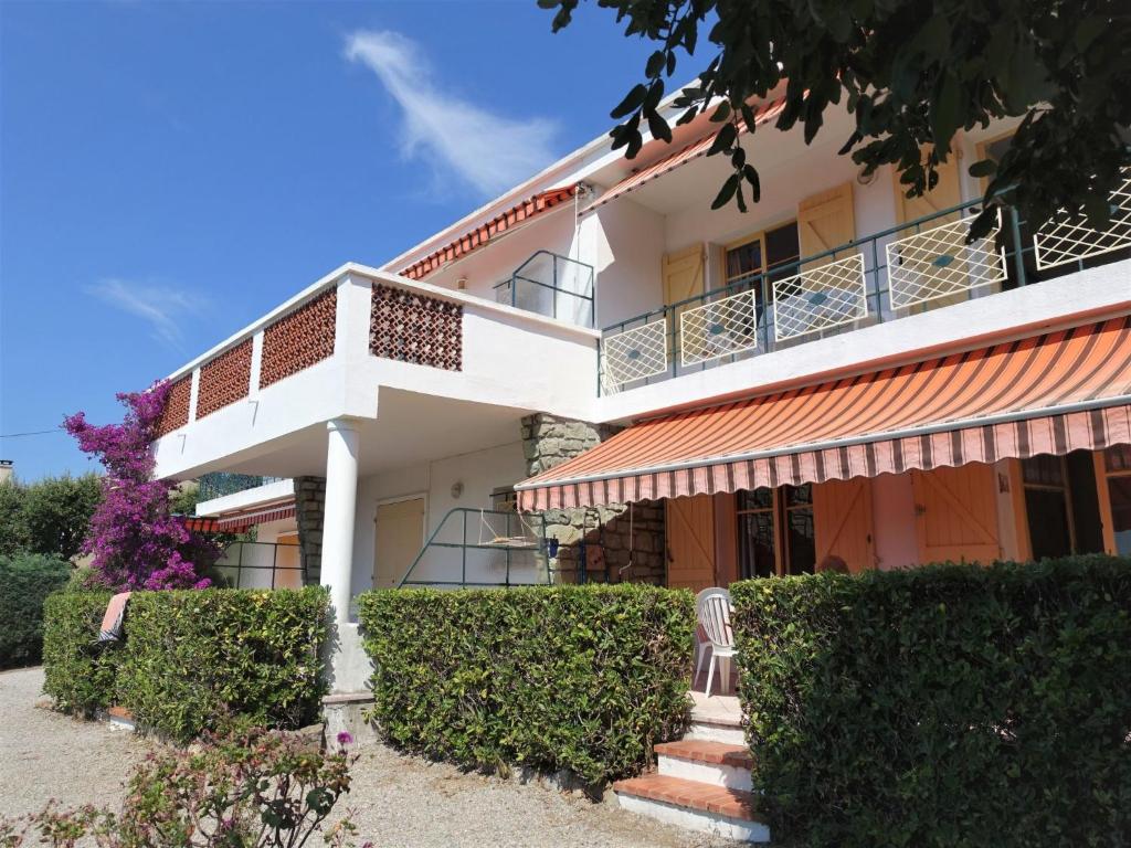 an exterior view of a building with bushes at Apartment Riva Bella-1 by Interhome in Cavalaire-sur-Mer