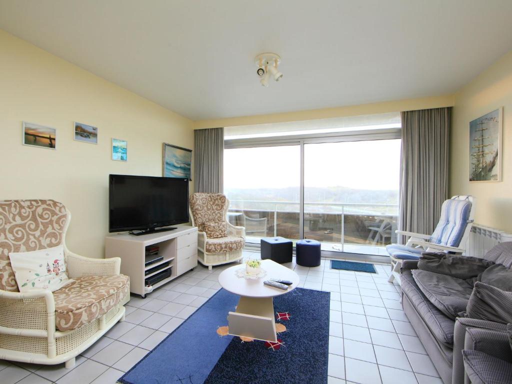TV a/nebo společenská místnost v ubytování Apartment Residentie Astrid app- 703 by Interhome
