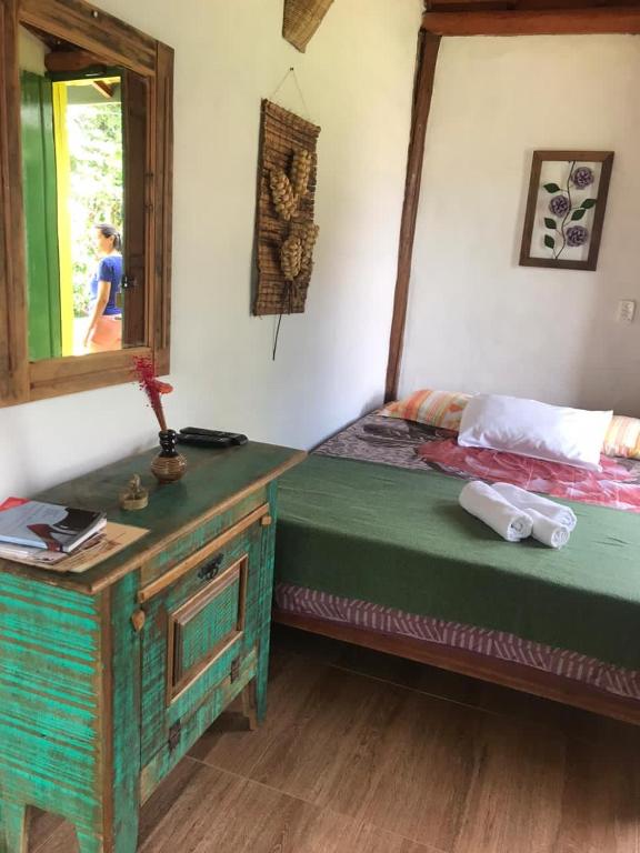 Postel nebo postele na pokoji v ubytování Pousada Villa Cachoeira