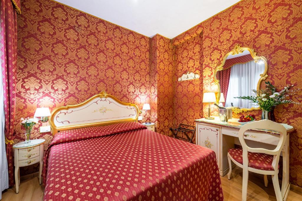 Postel nebo postele na pokoji v ubytování Al Gazzettino
