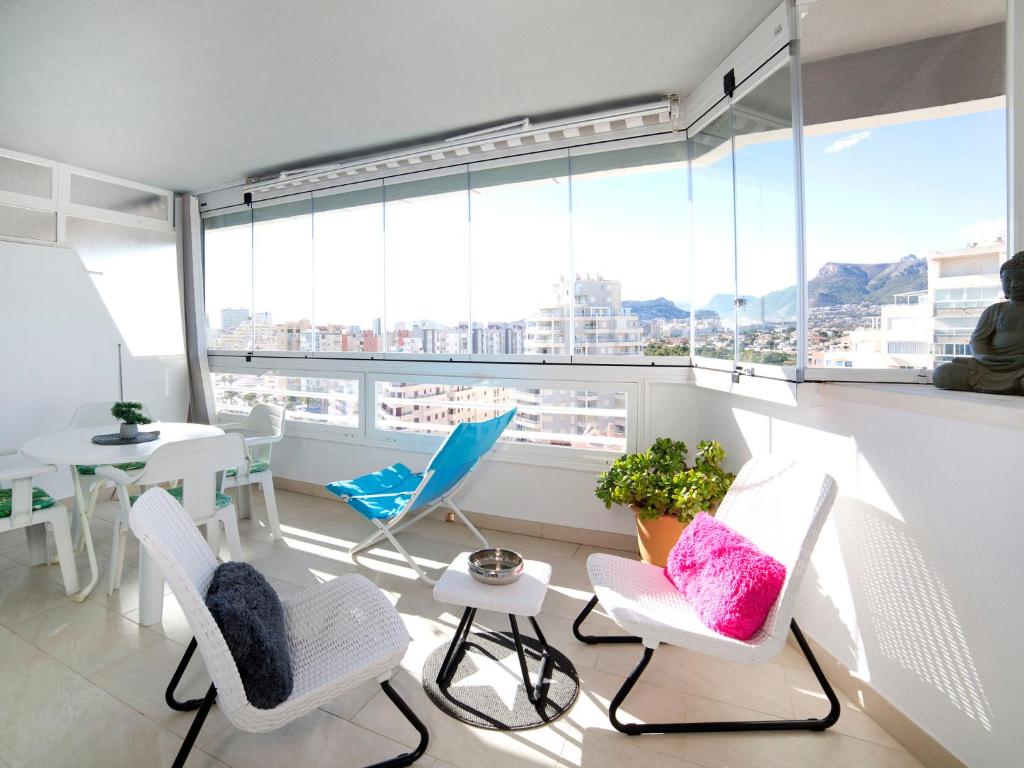 a room with chairs and a table and a large window at Apartment Esmeralda 02 by Interhome in Calpe