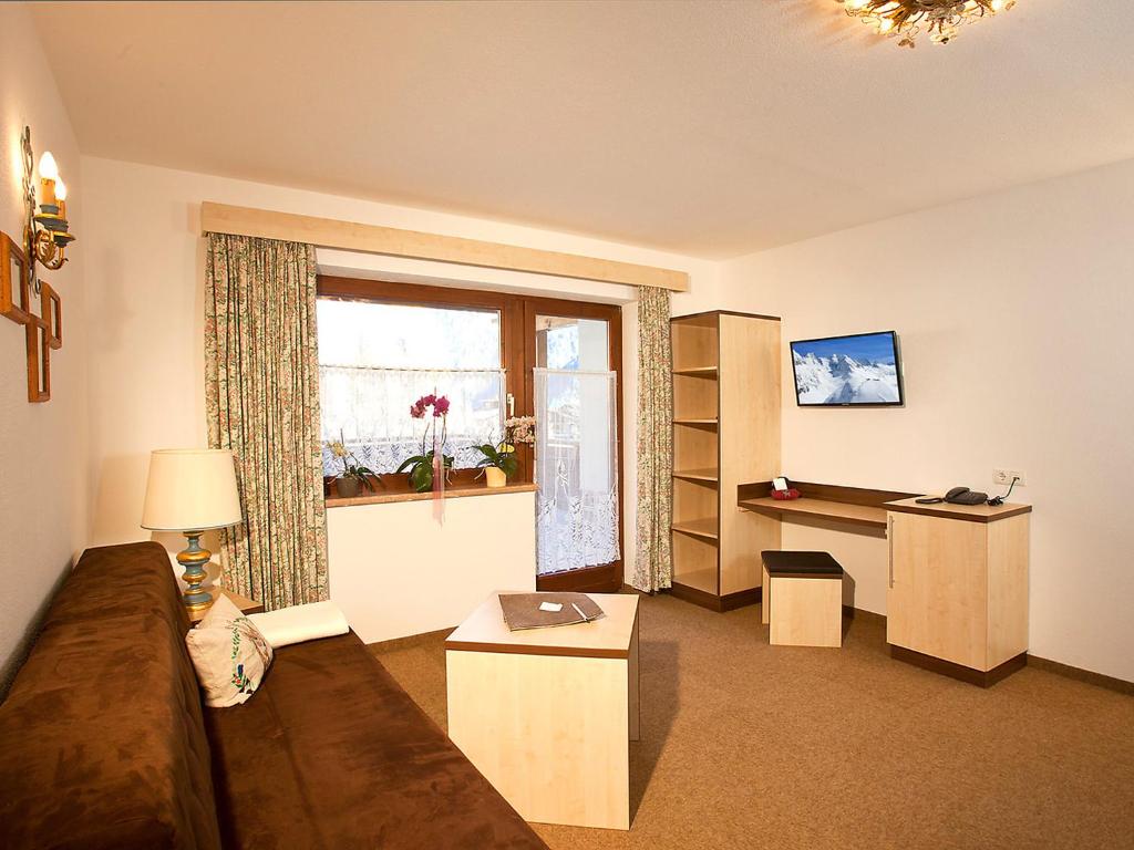 A television and/or entertainment centre at Apartment Alpin-1 by Interhome