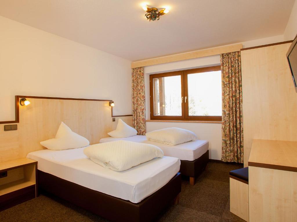 A bed or beds in a room at Apartment Alpin-1 by Interhome