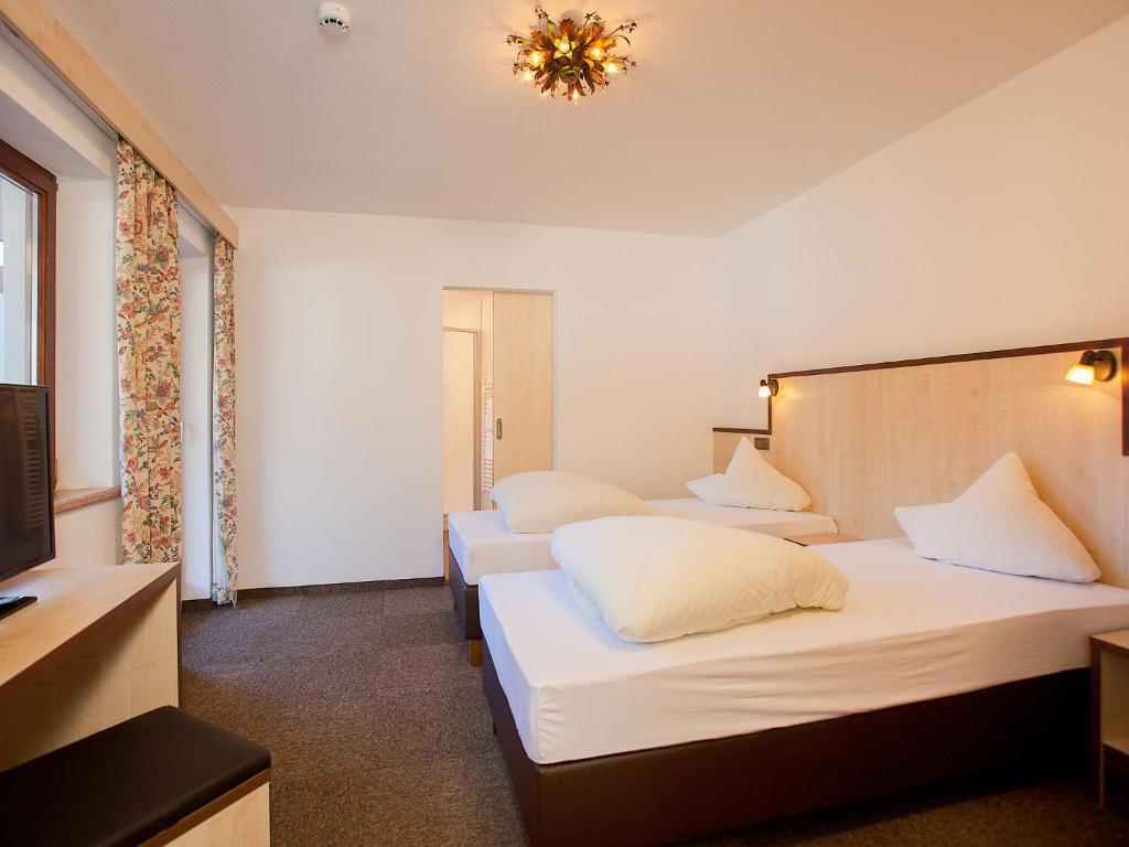 A bed or beds in a room at Apartment Alpin-1 by Interhome
