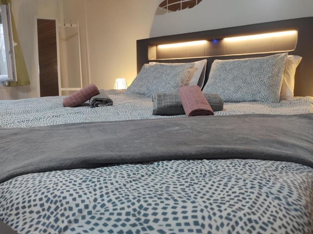 a large bed with a head board and pillows at Apartment Iskra in Plitvička Jezera