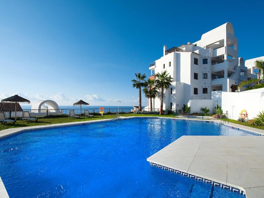The swimming pool at or close to Apartment in Torrox Coast- front seaview by Interhome