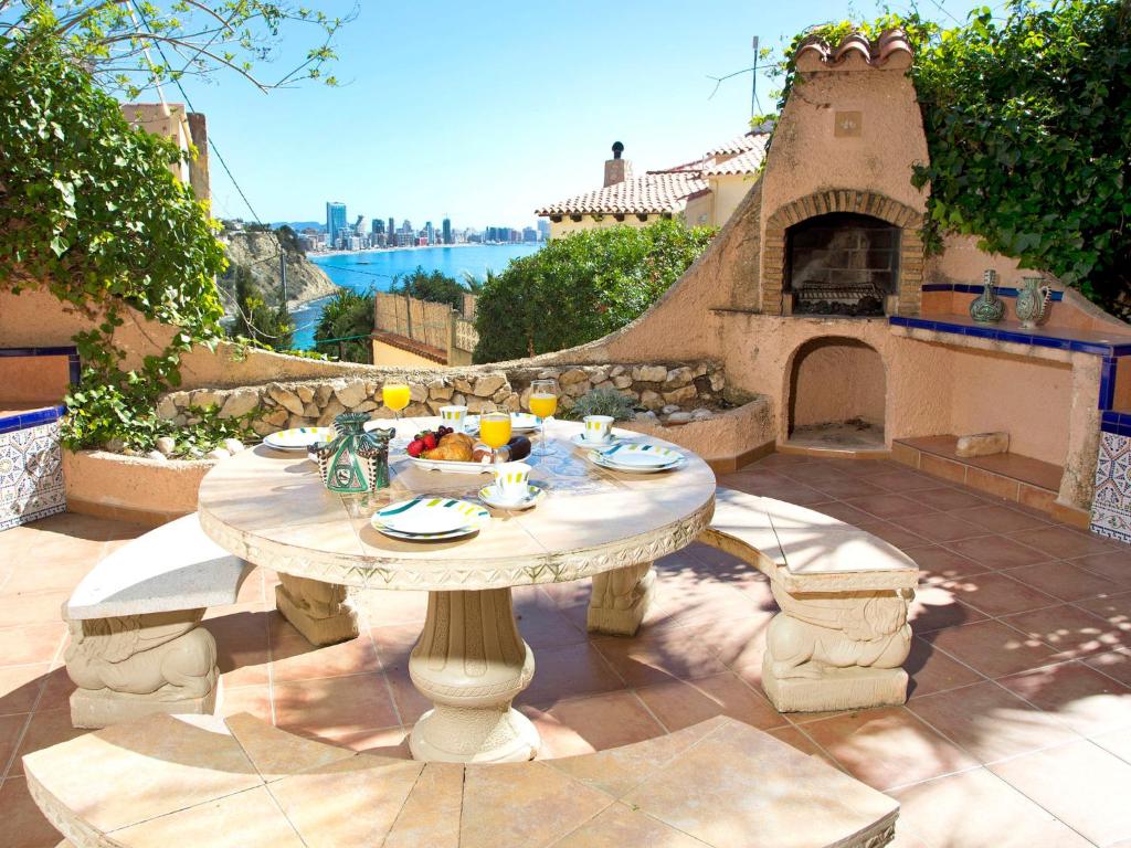 a table with food on top of a patio at Apartment Triton 01 in La Canuta