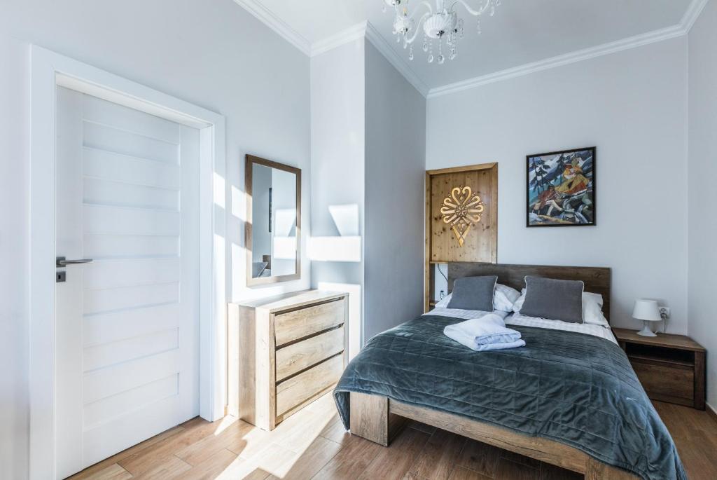 Posteľ alebo postele v izbe v ubytovaní ApartHost Jagiellońska Residence