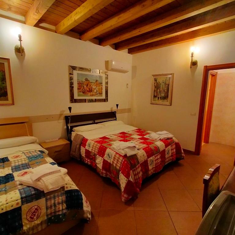 A bed or beds in a room at Terra del Sole Vittoria