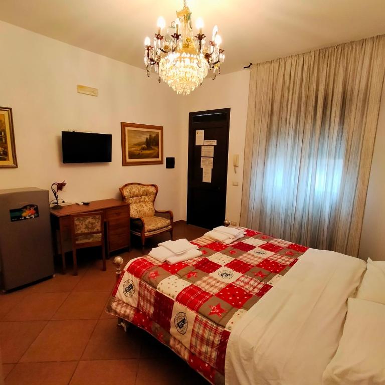 A bed or beds in a room at Terra del Sole Vittoria