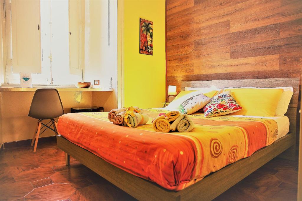 a bedroom with a bed with bananas on it at Non ci resta che Napoli in Naples