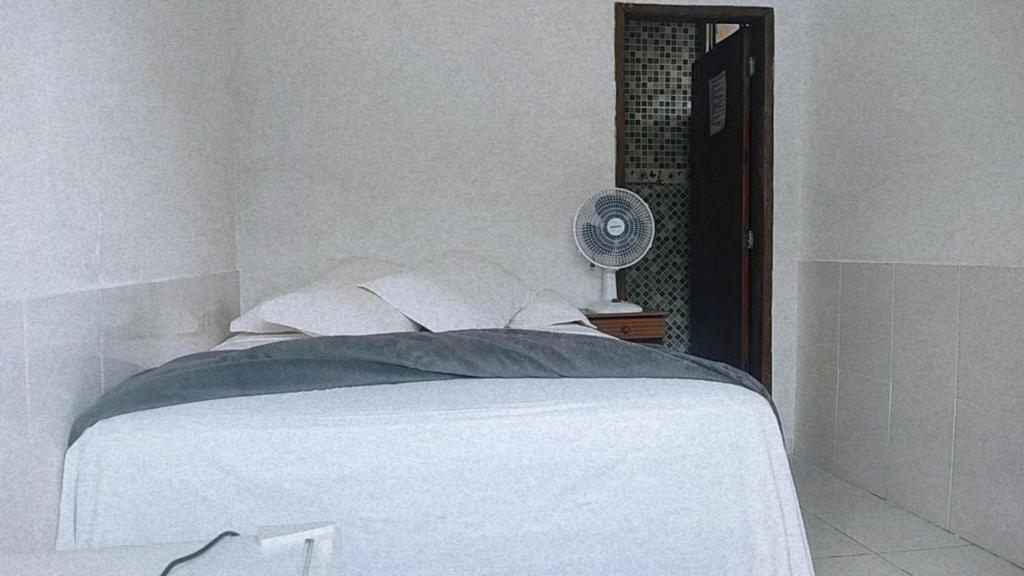 Cama ou camas em um quarto em Pousada Aquarela