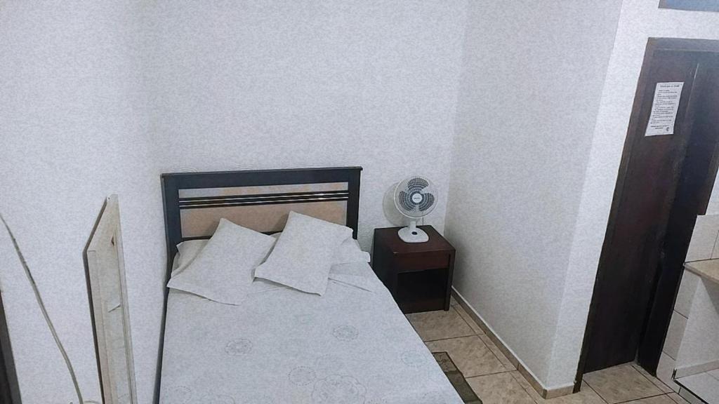 Cama ou camas em um quarto em Pousada Aquarela