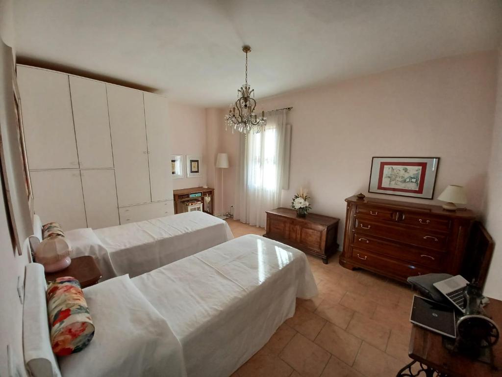 Postel nebo postele na pokoji v ubytování Casa Vacanze L'Acquerello