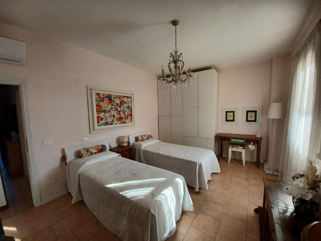 Postel nebo postele na pokoji v ubytování Casa Vacanze L'Acquerello