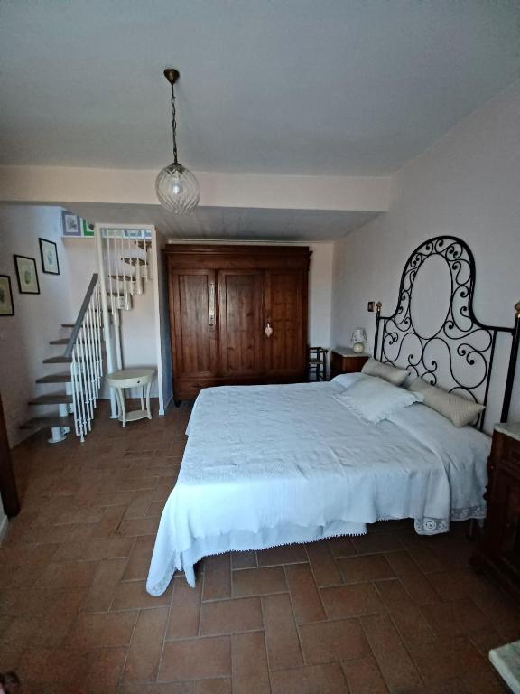 Postel nebo postele na pokoji v ubytování Casa Vacanze L'Acquerello