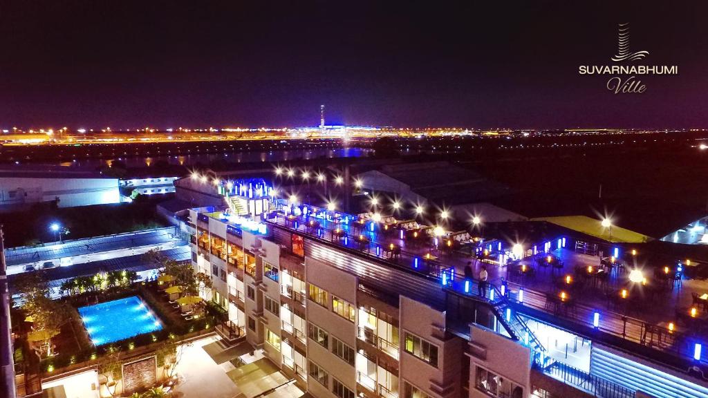 a view of a city at night with lights at Suvarnabhumi Ville Airport Hotel in Lat Krabang